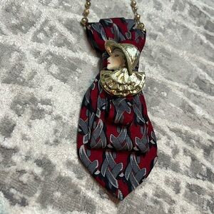 Upcycled tie with vintage woman brooch on gold necklace
